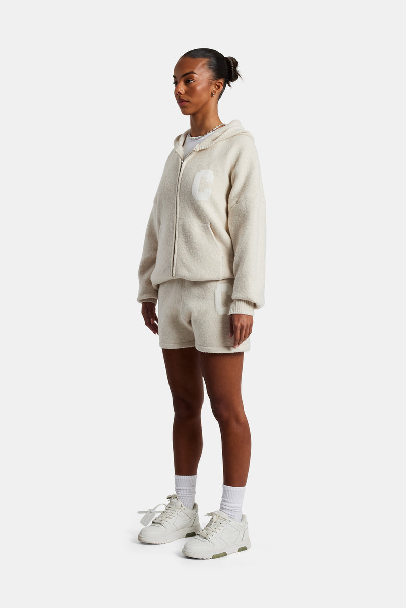 female model wearing the Hooded Zip Through Knitted Short Tracksuit in oatmeal