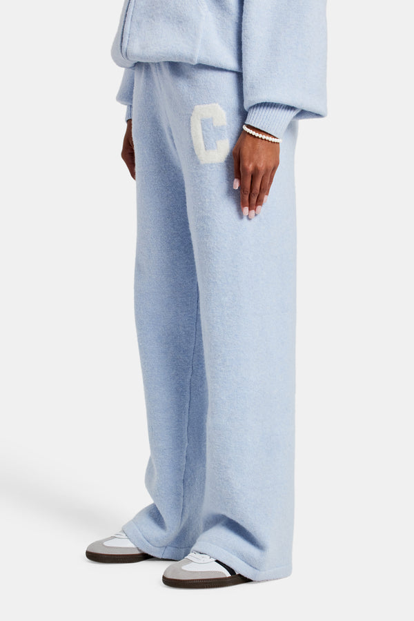 female model wearing the wide leg knitted jogger in light blue