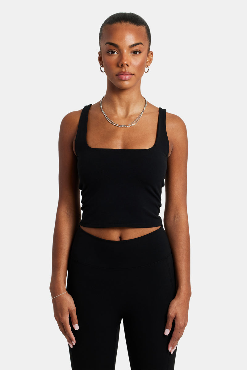 Female model wearing the square neck top in black