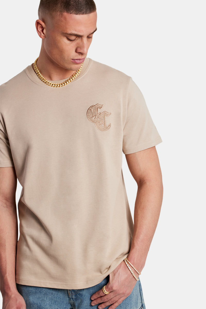 Male Model wearing Taupe T-shirt with C detail