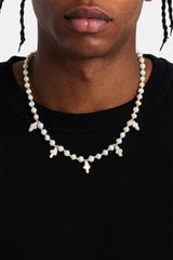 Male model wearing the freshwater pearl cross necklace