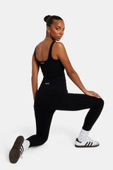 Female model wearing the deep waistband leggings in black