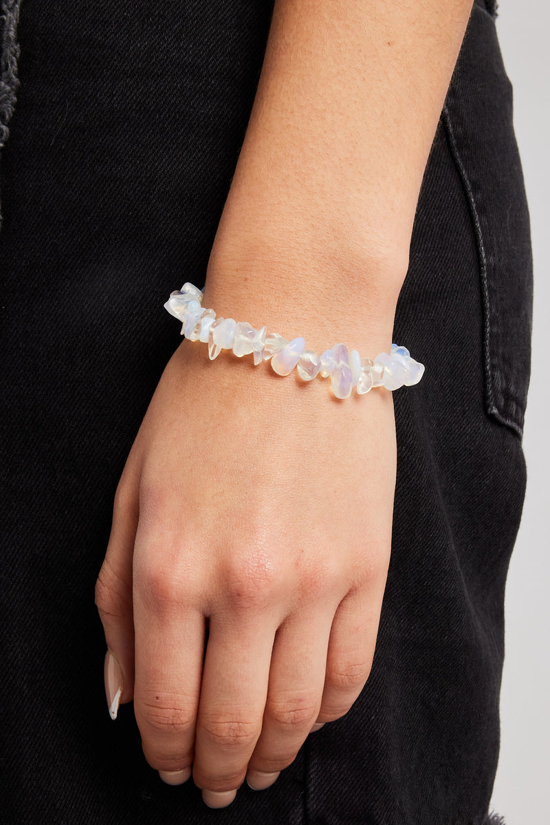 Female model wearing the opal shard bead bracelet in white